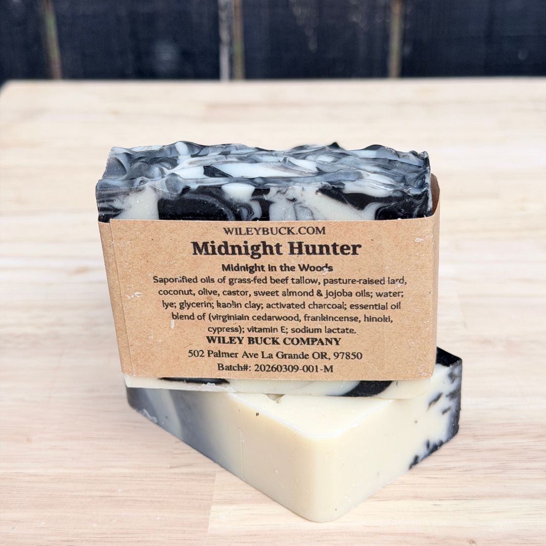 Bar of soap with a label on a wooden surface