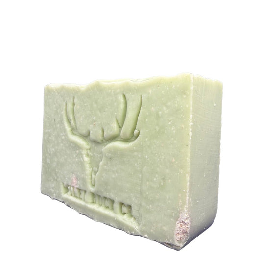 Green soap bar with a logo on a white background
