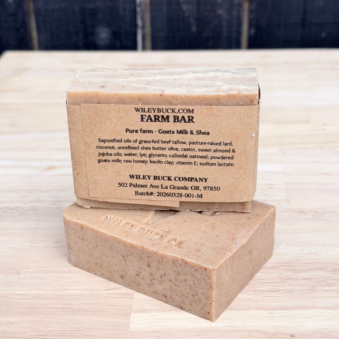 Bar of soap with a brown paper label on a wooden surface