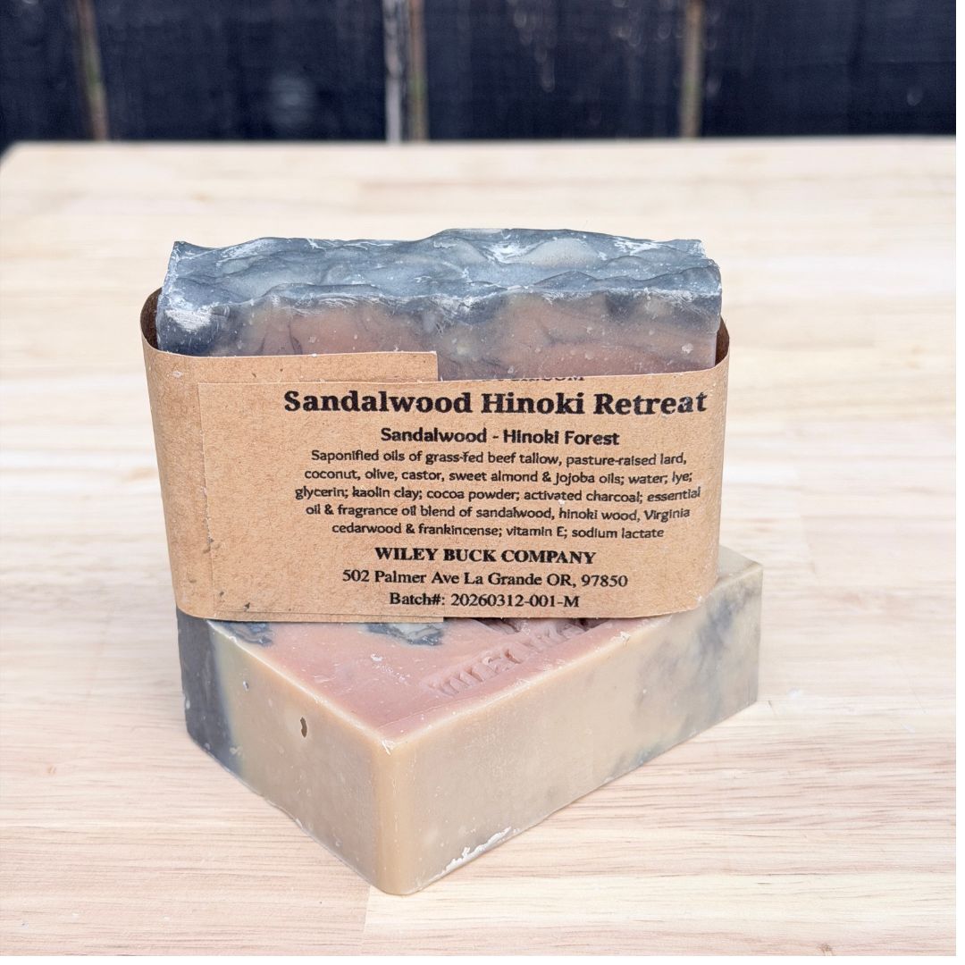 Bar of soap with a label on a wooden surface