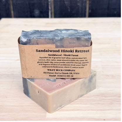Bar of soap with a label on a wooden surface
