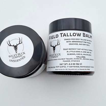 Two containers of Field Tallow Balm from Wiley Buck Company on a white background