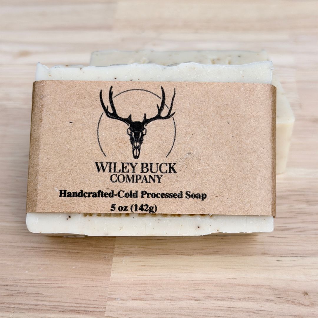 Bar of soap with a Wiley Buck Company label on a wooden surface