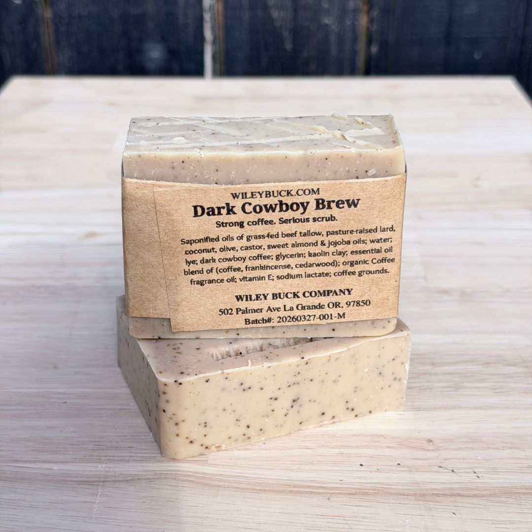 Bar of soap with a label on a wooden surface