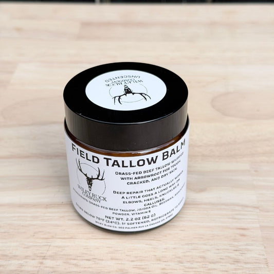 Field Tallow Balm jar on a wooden surface