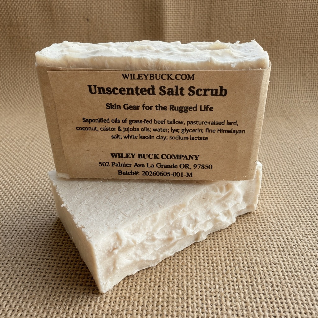 Bar of unscented salt scrub with a brown label on a textured beige background